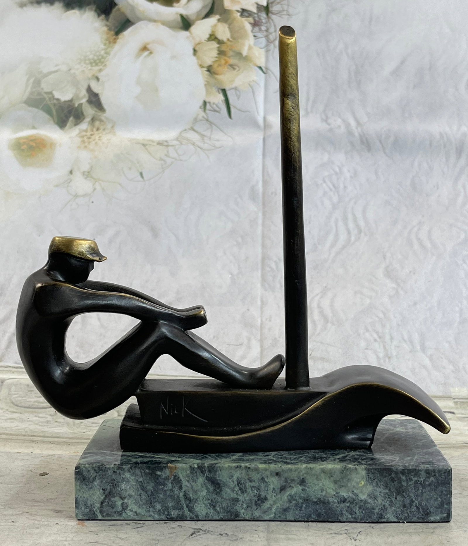 A Challenge Trophy for the Best Rower of the Year Bronze Sculpture: A powerful Bronze Sculpture, an interpretation of a man rowing a boat on rippling waters is by the artist Mario Nick. The beautifully rendered features hair tousled by the wind, mouth set in