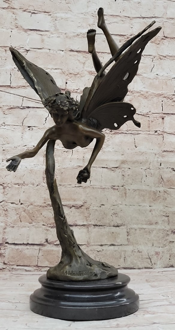 Angel Fairy Bronze Sculpture: A Fairy Flies from Heaven. She hails from the heavens and fights for the salvation of our world as well as his from darkness of any form. She wears a robe and sandals, carrying a message with her