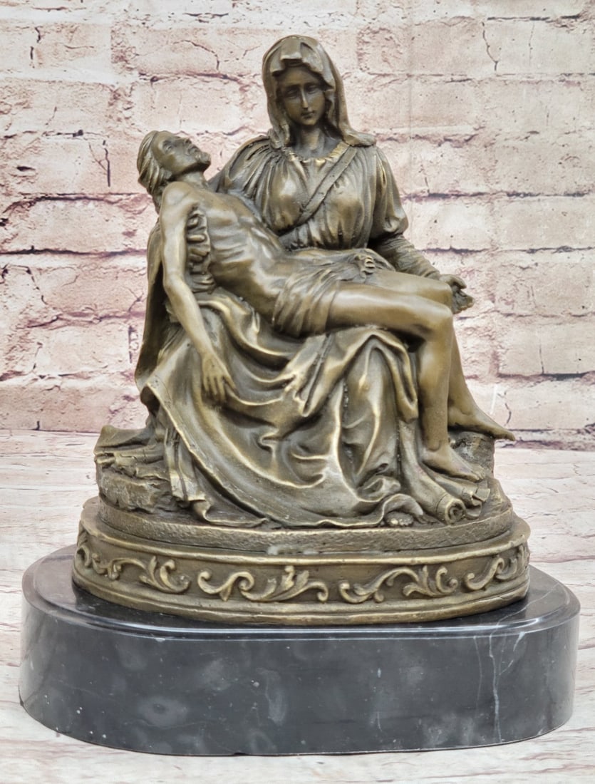 La Pieta Statue of The Virgin Mary Bronze Sculpture: This Sculpture was cast using the Lost Wax Method and has a brown patina and is mounted on a marble base. Dimensions: Height 11 X Width 8 inches. Weight: 12 LBS.