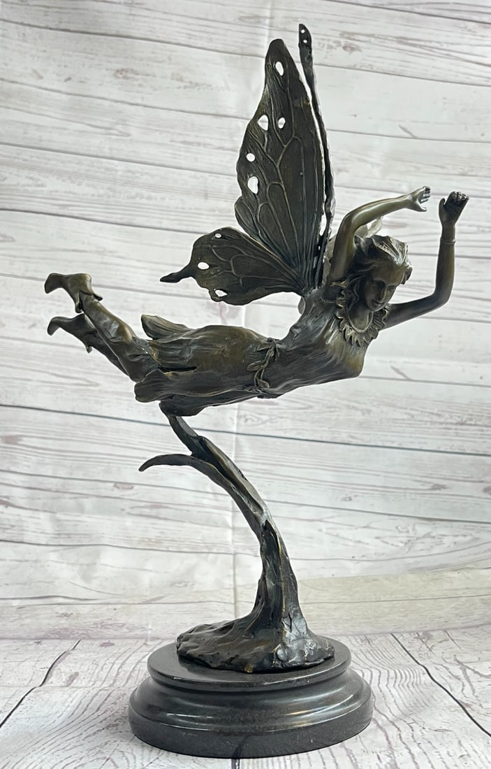 Angel Fairy Bronze Sculpture Mythical Statue: A Fairy Flies from Heaven. She hails from the heavens and fights for the salvation of our world as well as his from darkness of any form. She wears a robe and sandals, carrying a message with her