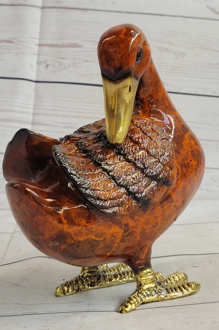 Standing Duck Brass Cold Painted Bird Sculpture: This Bronze Sculpture was produced using the Lost Wax casting method. The Lost Wax Cast method is the most precise metal casting technique in existence, ensuring exquisite detail of the original host