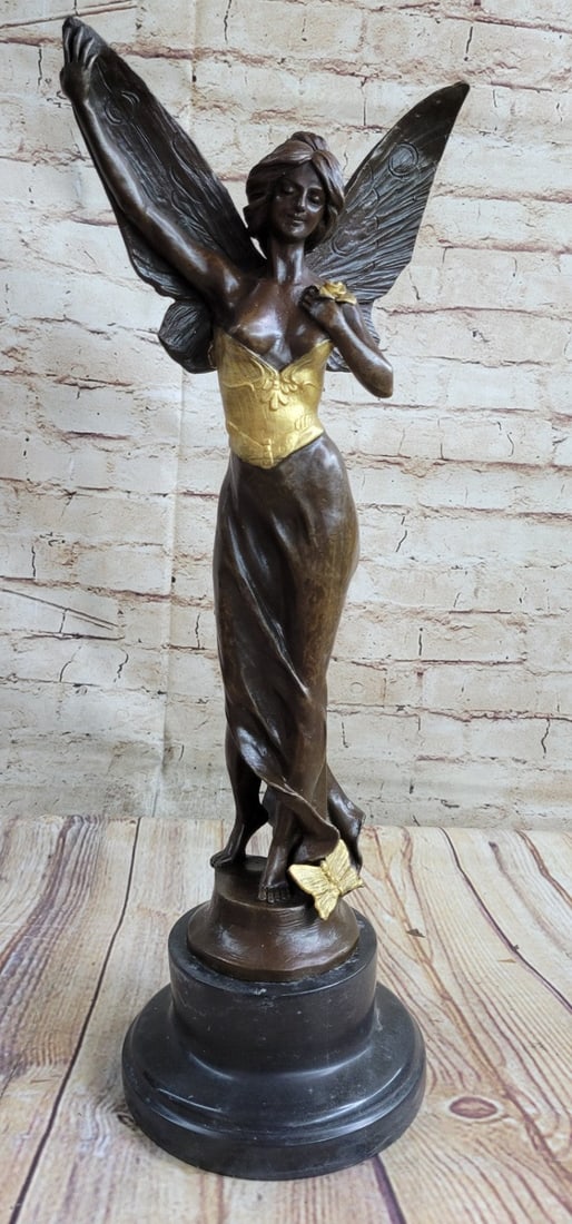 French Angel Standing on Rock Bronze Sculpture: Daydreamers will fall in love with this daydreaming fairy. She wanders around the mystical forest, her eyes taking in all the magic around her. She is lulled by the soft sounds of life and fantasy aro