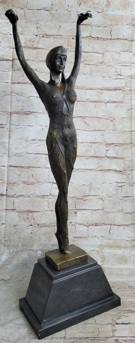 Bronze Art Deco Dancer Sculpture: The beautiful dancer walks gracefully towards her audience, on tiptoes, with both arms raised with hands nimbly hanging. Her finely detailed bodysuit, glimmering with beads, shows the contours of her 