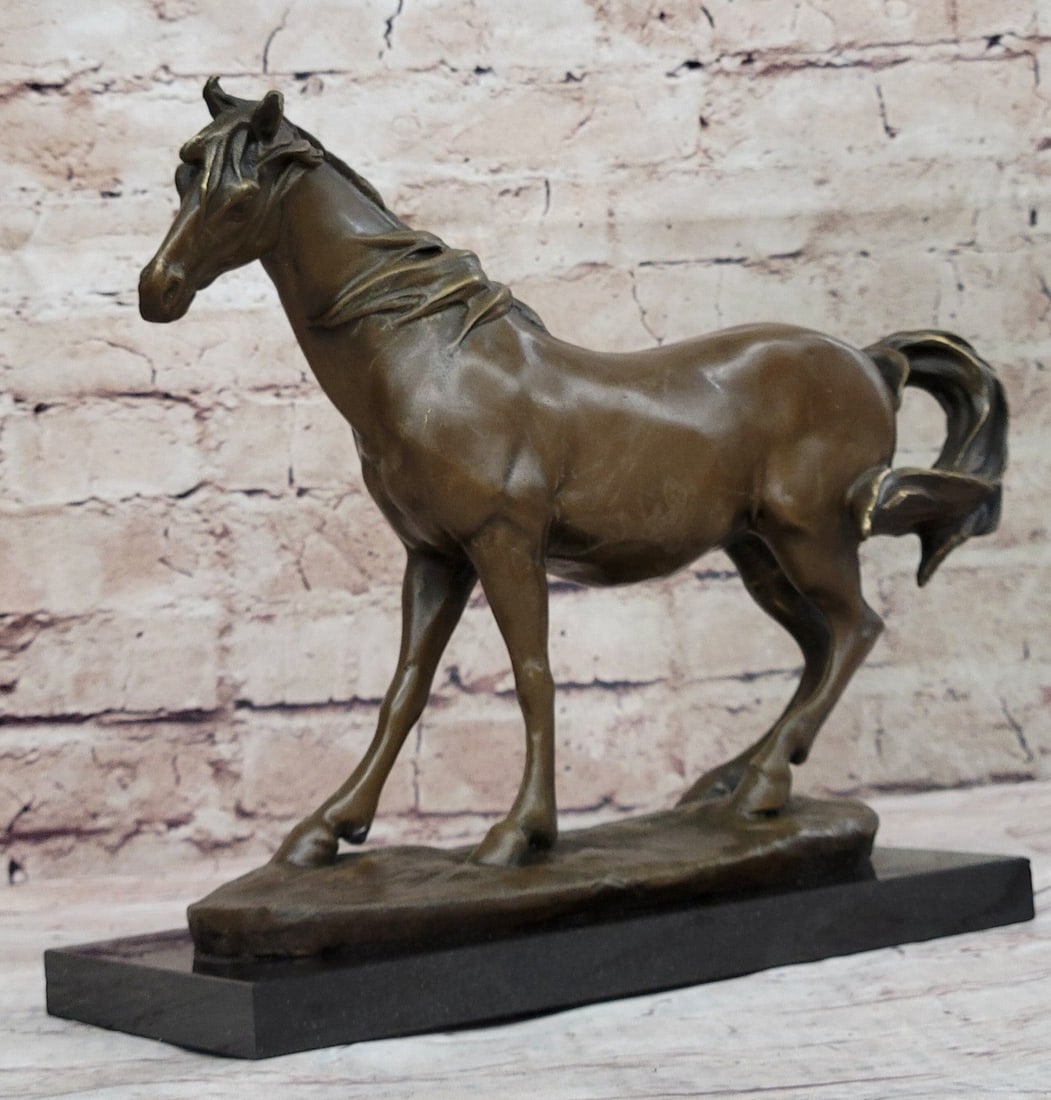 Stallion Horse Bronze Sculpture: This gorgeous bronze sculpture shows an absolutely fine specimen of a stallion standing on the cliffs of the mountain and the wind blows from behind him and pushes his mane and tail up towards his