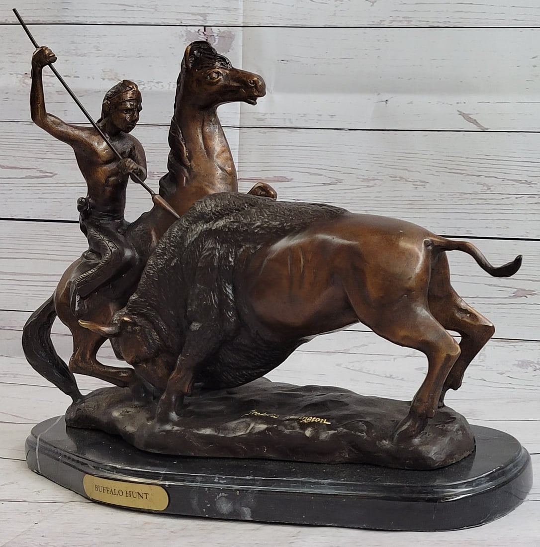American Buffalo Bronze Statue: This amazing sculpture is of a Native American Hunter on his horse slaying a buffalo with a spear. He sits firmly on his trusted horse as it rears itself up and draws back his strong arms that hold hi
