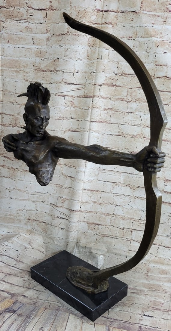 Indian Warrior With Bow and Arrow Bronze Sculpture: The Bronze Sculptures' unique composition, seems as if the entirety of the body is slowly being taken, particle by particle, like dust in the wind. The beholder sees the final stages of this creative 