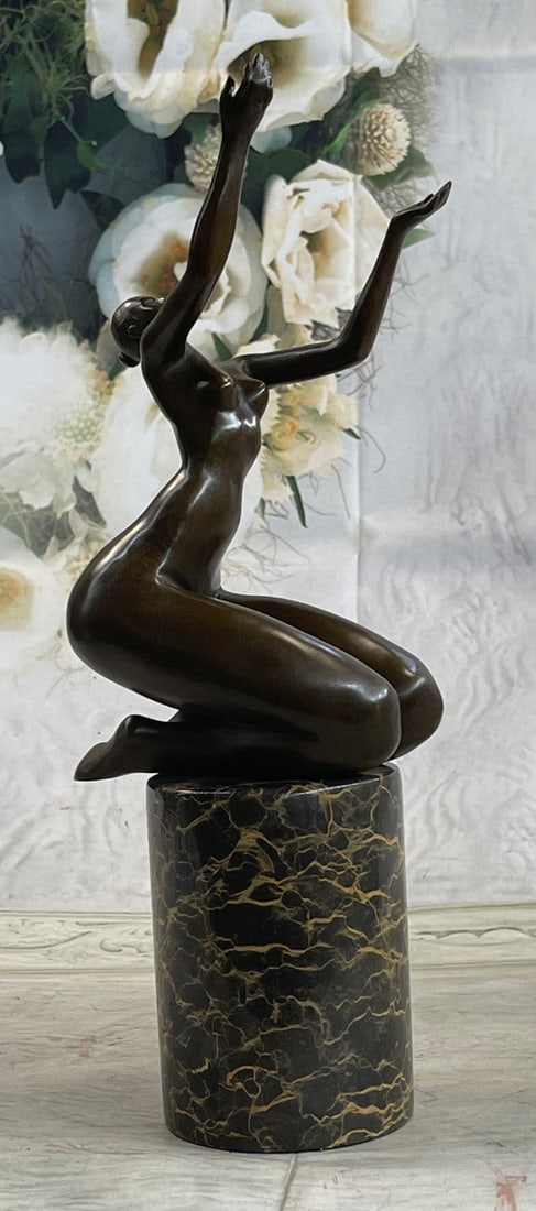 God Help Me Bronze Sculpture: An abstract beauty poses for a portrait. She stretches her long round body. She kneels and curls an arm upward. Like a classic pin-up, she pushes her chest out, tilts her head up, and is ready for her