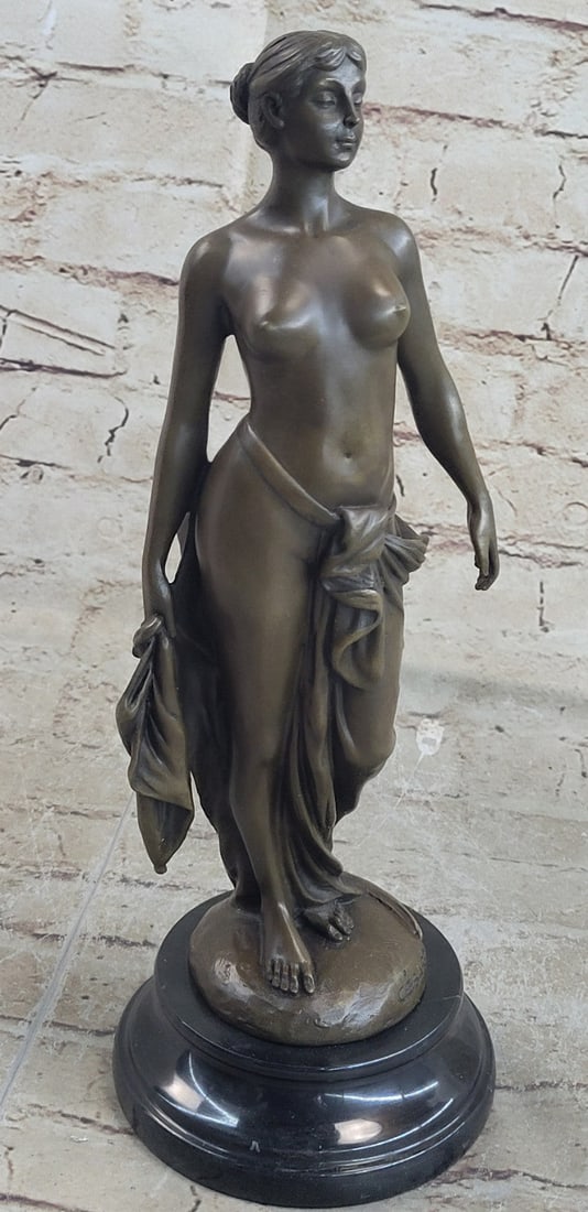 Nude Girl Bronze Sculpture: She long her and sexy legs as she puts on a private exhibition. Cast using the Lost Wax Method in a Brown patina and mounted on a marble base. Dimensions: Height 13 X Width 5 inches. Weight: 6 LBS.