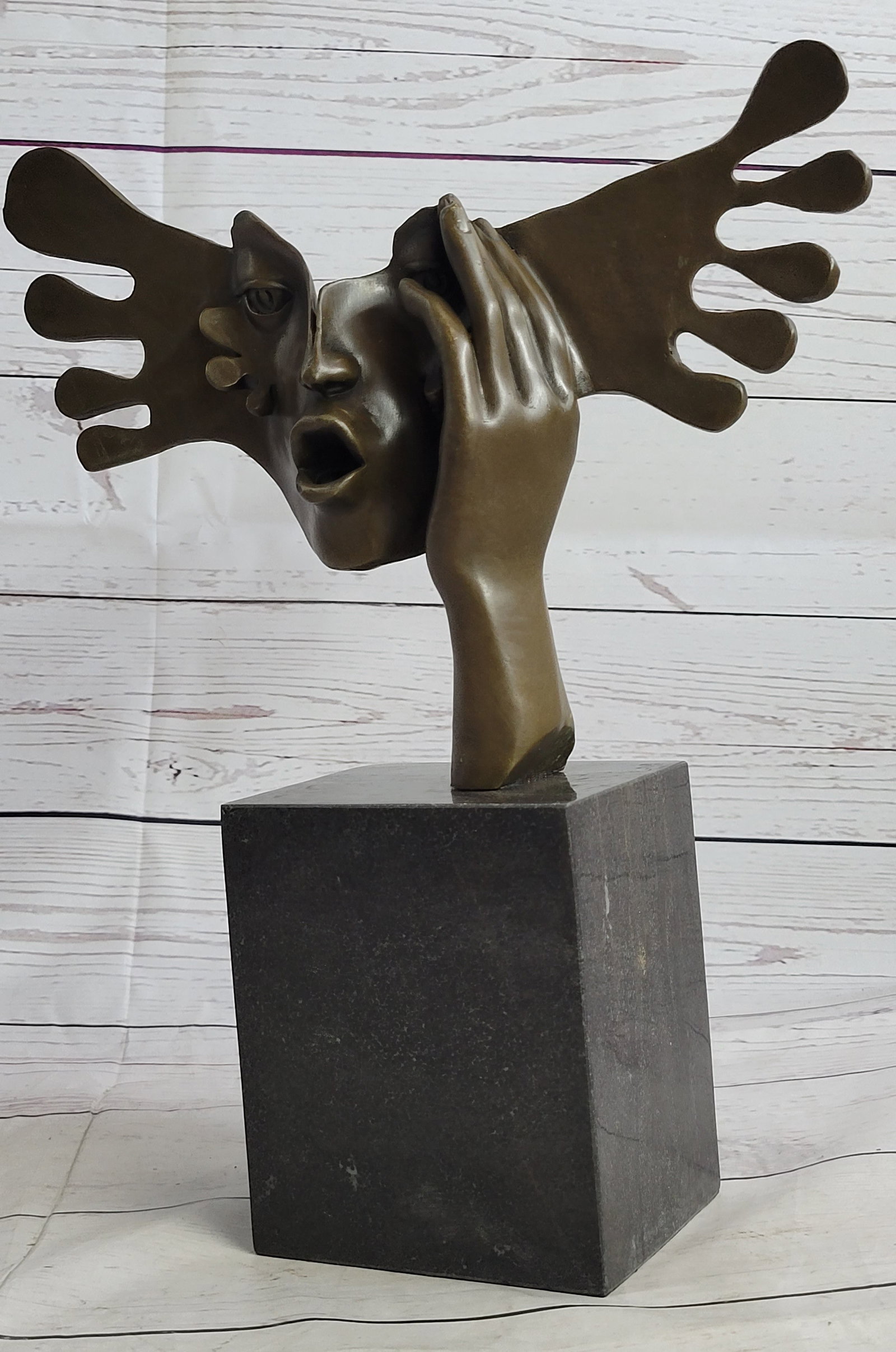 Modern Bronze Sculpture: This fine work of art was cast in pure bronze using the hot cast lost wax method and mounted on a marble base. Dimensions: Height 14 X Width 12 inches. Weight: 13 LBS.