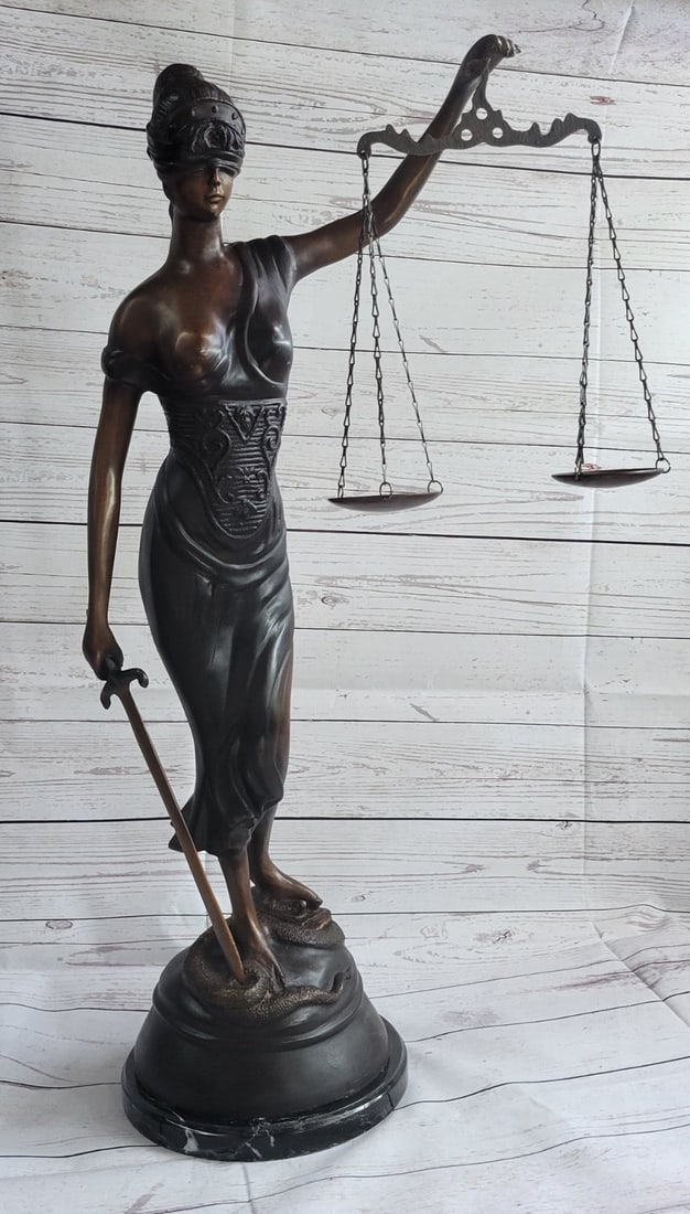Lady Justice Bronze Sculpture: This amazing sculpture is entitled, Blind Justice. The woman in this statue is Themis, a Titan and pre-roman empire figurine. Like it is named stands the woman blinded by an intricate head garment,