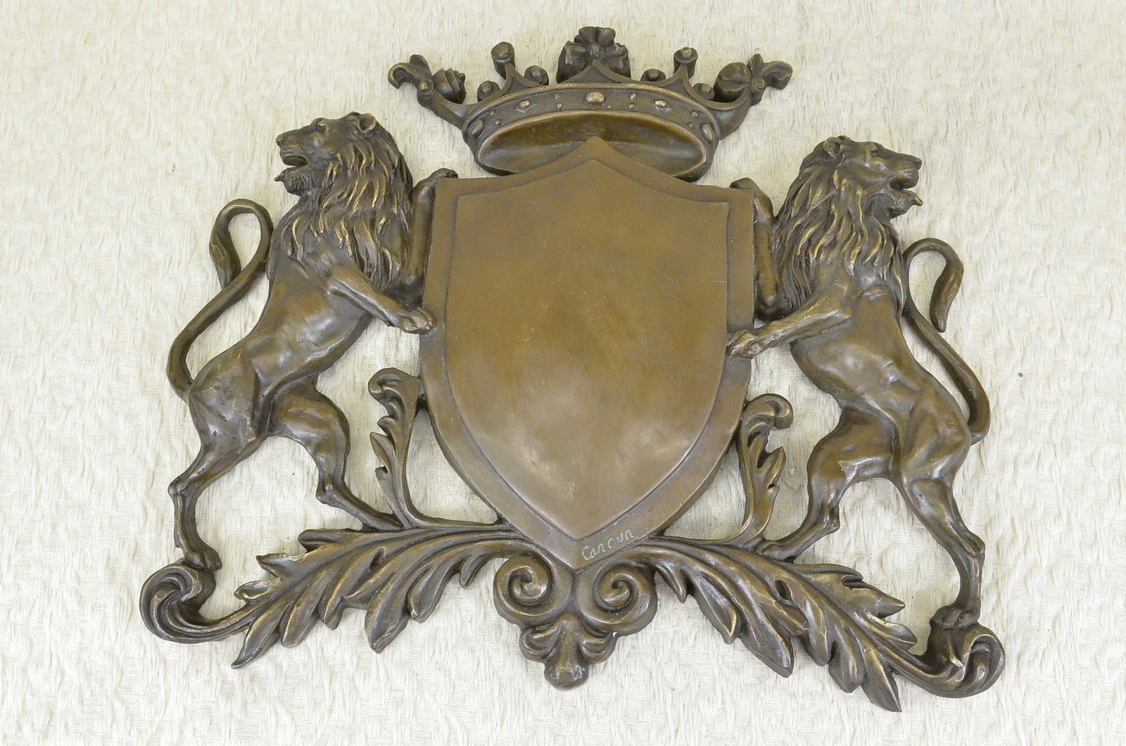 Lion Crest Family Heirloom Bronze Sculpture: This amazing piece that would go lovely as a family traditional crest describes the power behind a shield and two lions, they were used as a way of protection from all weapons, enemies, evil, etc. The