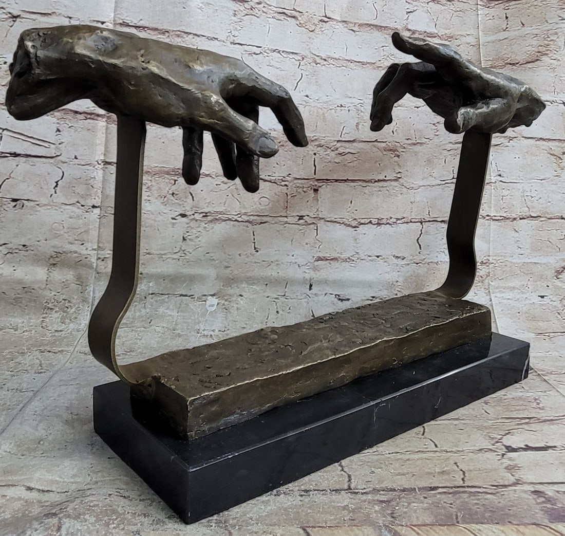 Touching Hand Bronze Sculpture: This is a unique representation of the famous artist, Michelangelo painting, The Creation of Adam. The painting is a section of Michelangelo fresco Sistine Chapel ceiling painted circa 1511. It illust