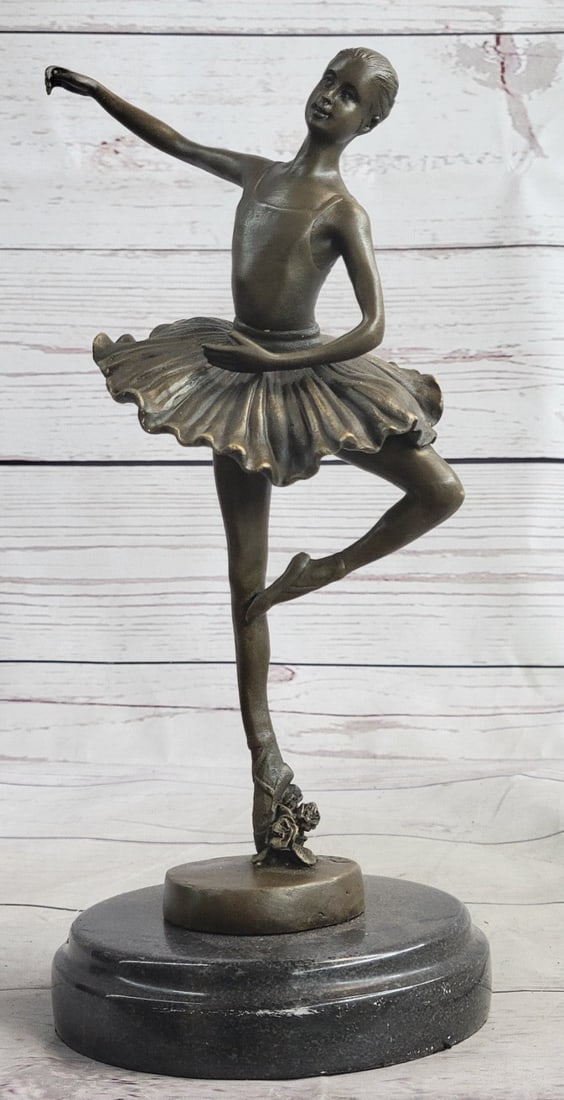 Prima Ballerina Bronze Sculpture: The sculpture was crafted using the lost wax method and rests on a marble base. Dimensions: Height 11 X Width 7 inches. Weight: 5 LBS.