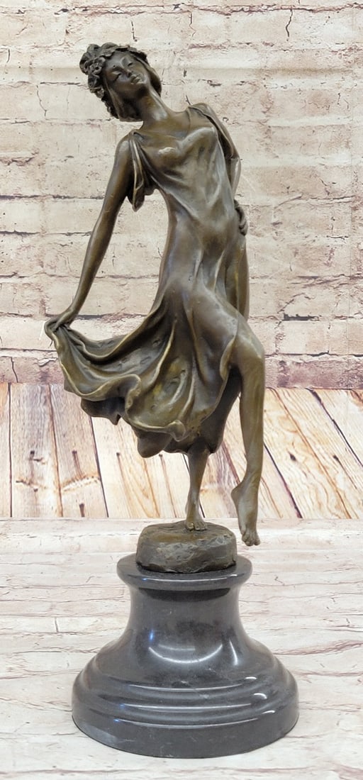 Dancer Bronze Sculpture: This astonishing piece of art is a magnificent art deco figurine. Her arms are outstretched to her side as she stands on one leg and balances, she is careful not to make a mistake during her