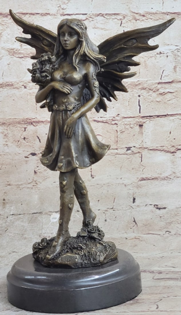 Angel of Love Holding Bouquet Bronze Sculpture: This adorable angel of love stands gracefully holding a bouquet of roses on her right arm. Her dress has these cute hearts on the edges of her flowing skirt, her frame is beautifully well kept. Her