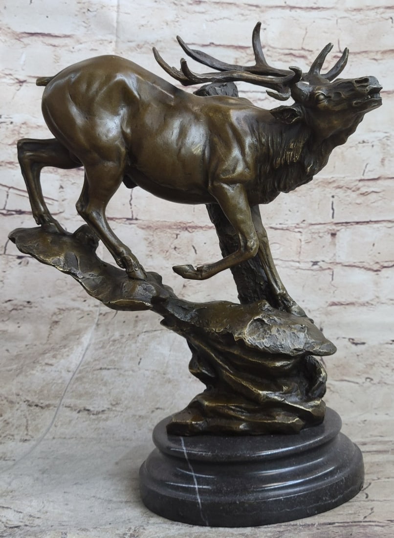 Male Elk Mountain Deer Bronze Sculpture: The male elk come down the forest edge offering a series of vocalizations for the mountains to echo across the sky and lands. He seems as though he is on a mission to find a mate. His large antlers