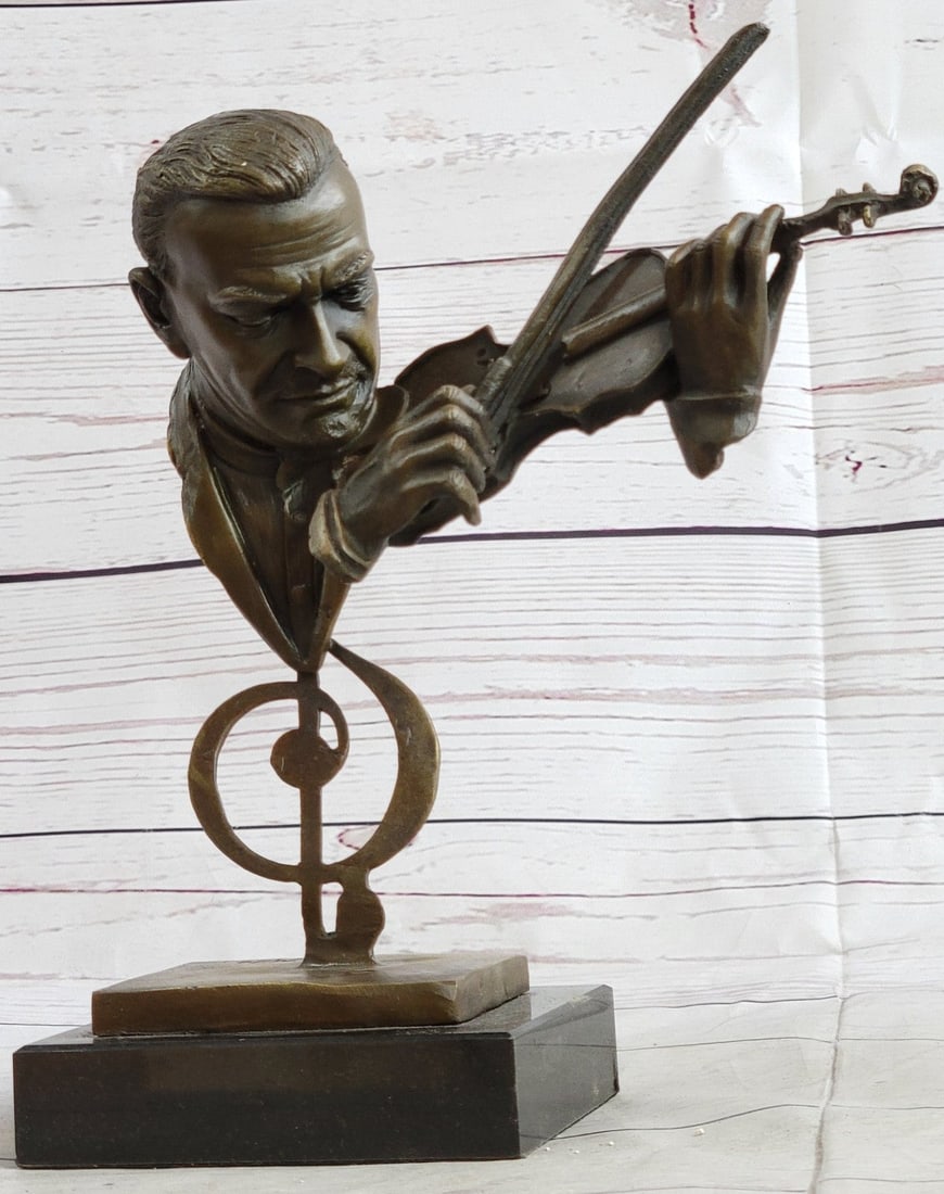 Man Playing Violin Bronze Sculpture: This amazing and creative abstract of a musician playing his violin is exquisite. He is made with the creation of your imagination. His eyes are concentrating on each string he touches, making sure he