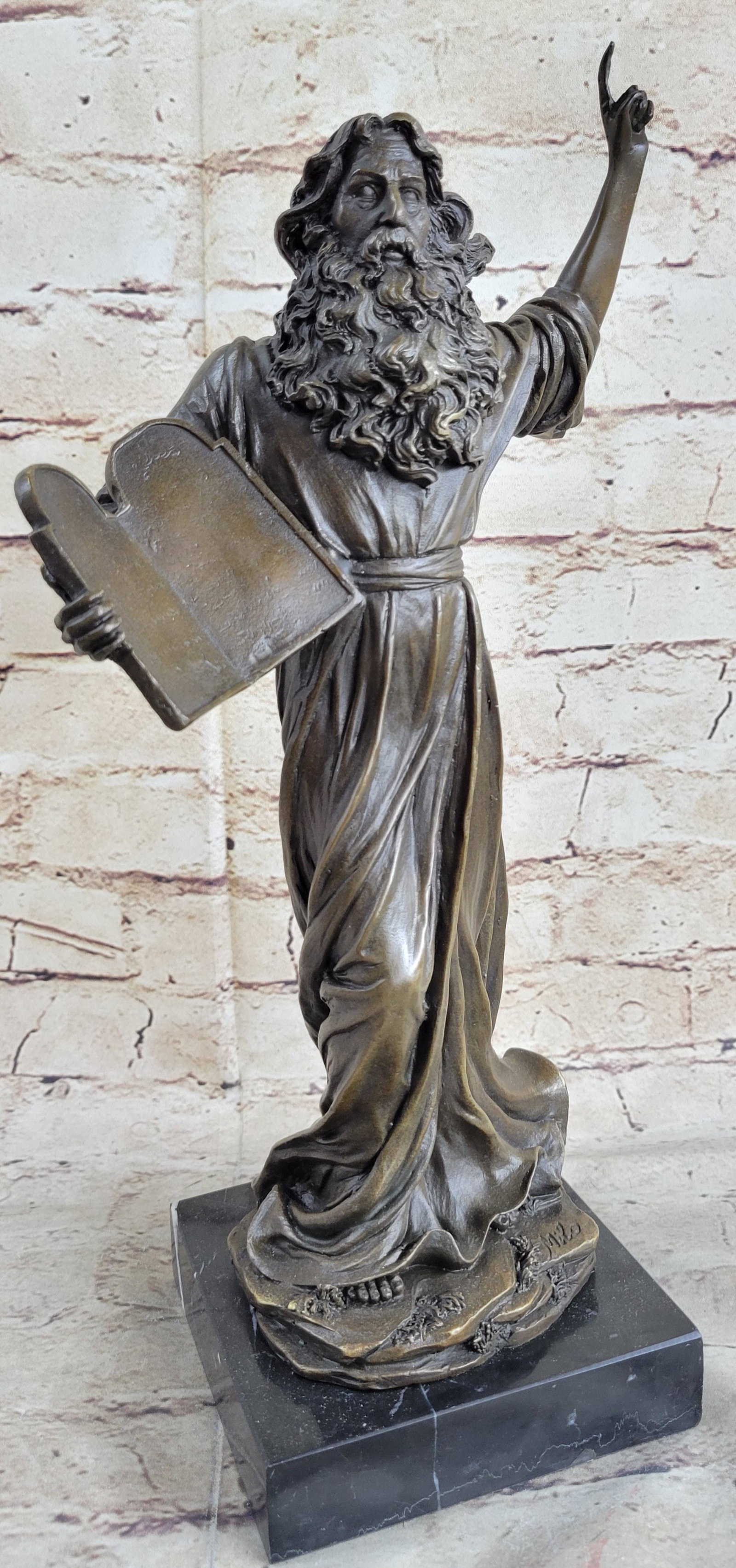 Moses Bust Jewish Christian Bronze Statue: This is his version of Moses bringing the Ten Commandments down from Sinai to the Children of Israel. Moses has a long beard and a rough robe. He cradles the tablets in one arm and gestures