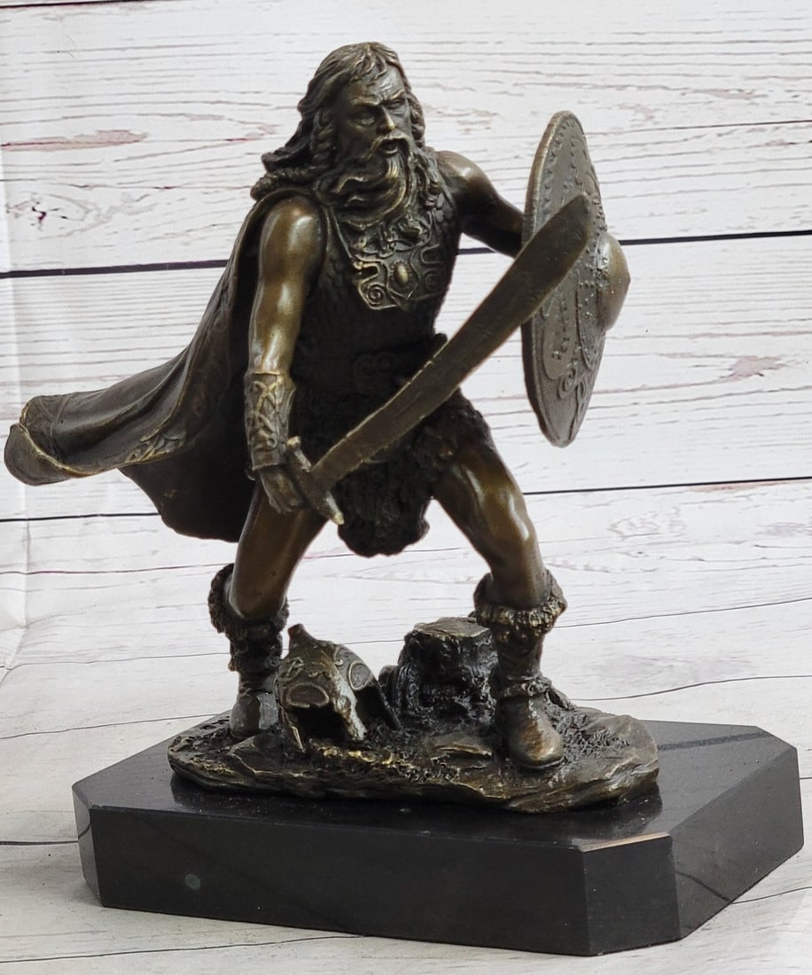 Warrior with Sword Bronze Sculpture: This European Warrior stands in a fighting pose ready to attack whoever comes close. He protects himself with his shield and his sword, as he stands on top of some stoops he does not show any look of 