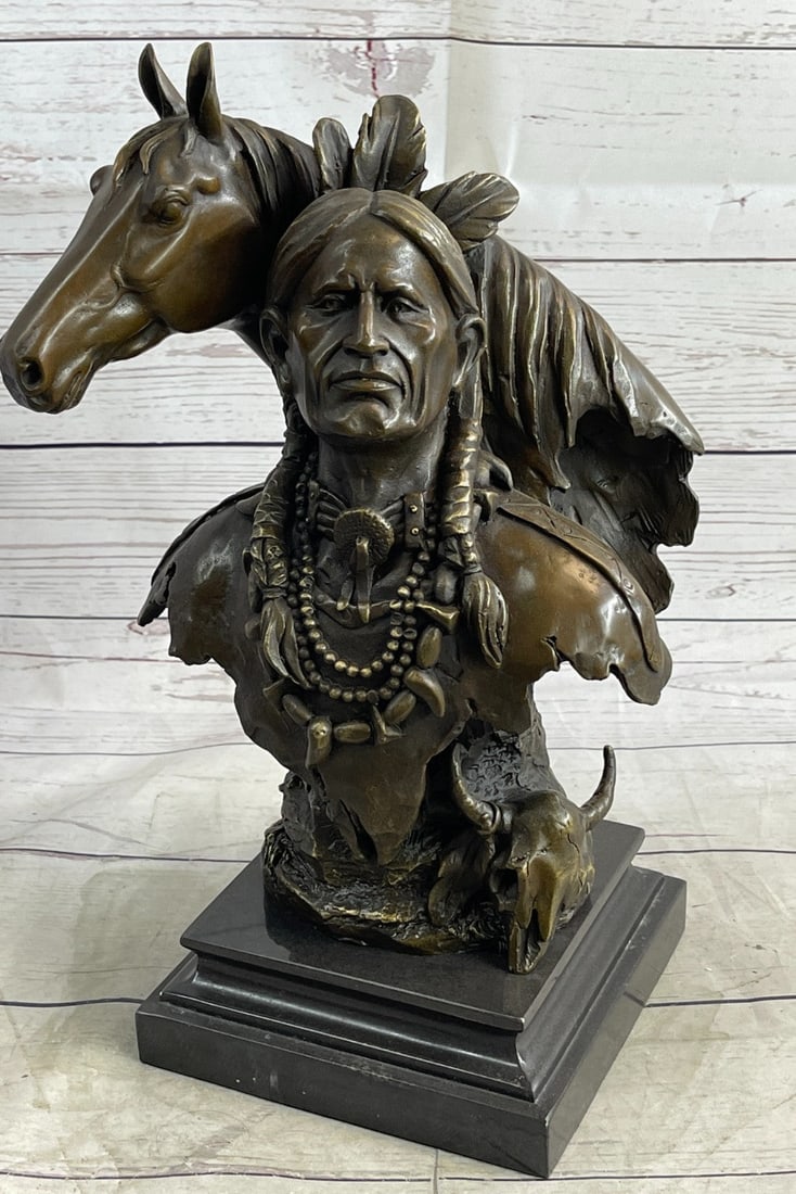 Western American Chief with his Horse Bronze Sculpture: This bust of a Native American and his horse is a calm and strong vision. The Indian culture, wisdom, and traditions are represented here in the detail of his braided long dark hair, the strands of be