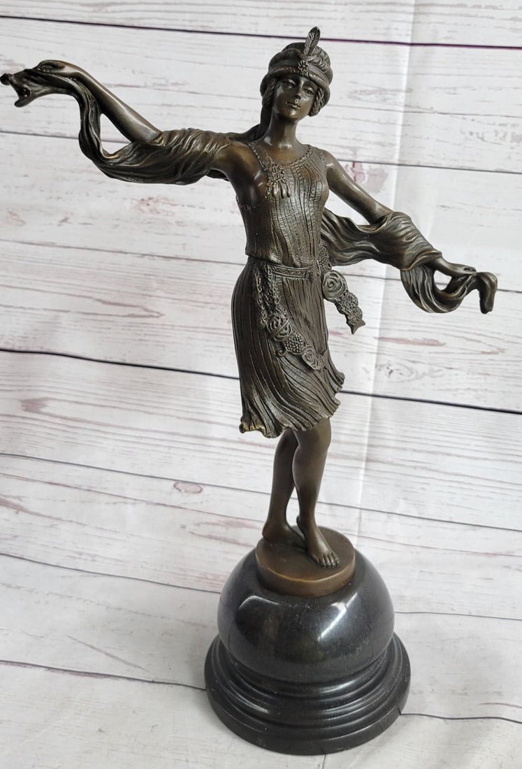 Dancer Bronze Sculpture: With grace, agility, and flexibility, this vibrant dancer is light on her toes. Bring the Caribbean into your home on many cold nights. Keep the tropics alive even when there is snow on the ground.