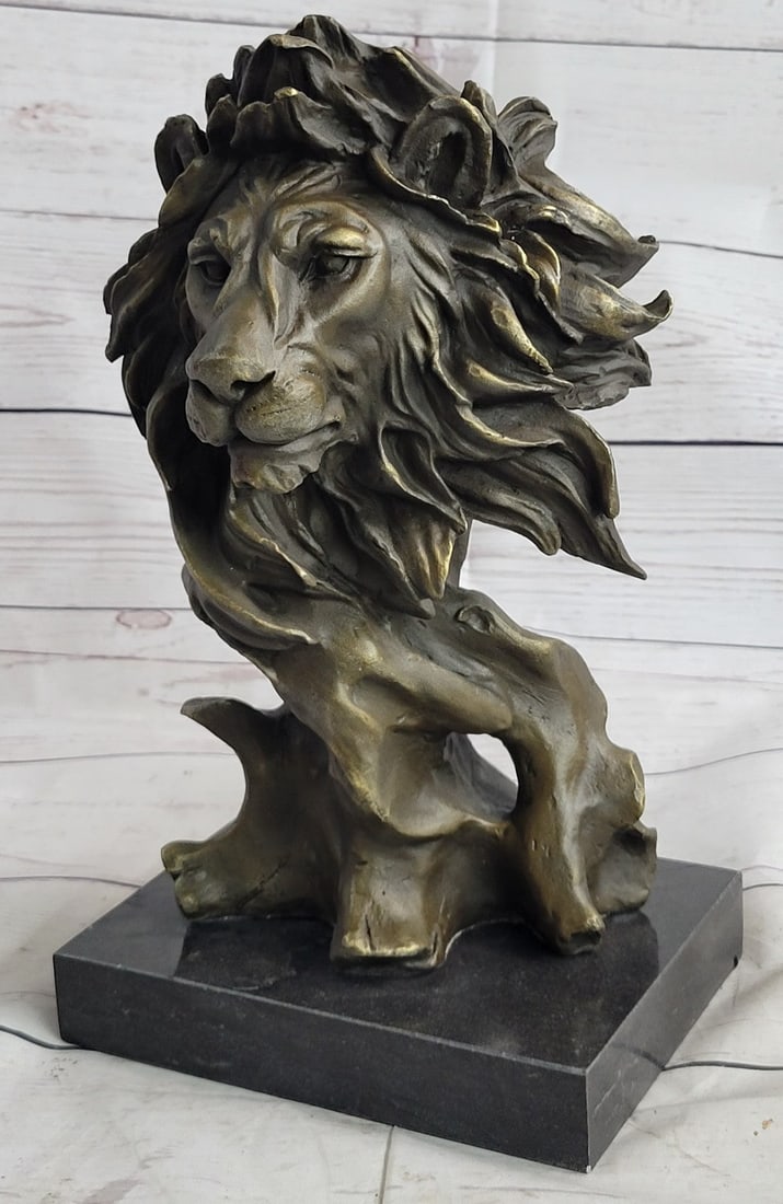 African Male Lion Bust Bronze Statue: With piercing eyes and a serious look, this lion is intimidating just by a glance. The exotic Lion Bust Sculpture expertly captures the majesty of this noble lord of the jungle and savannah. Handcraft