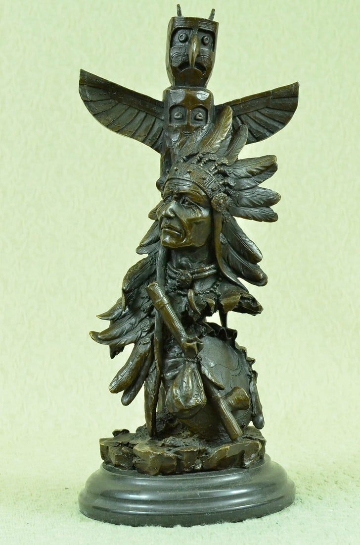 Warrior with Totem Pole Bird Bronze Sculpture: Legend tells us that Indians and wolves once lived in such harmony that their spirits aligned in life and even in the hunt. The artist recaptures the moment when the chief, scout, and wolf scan and ea