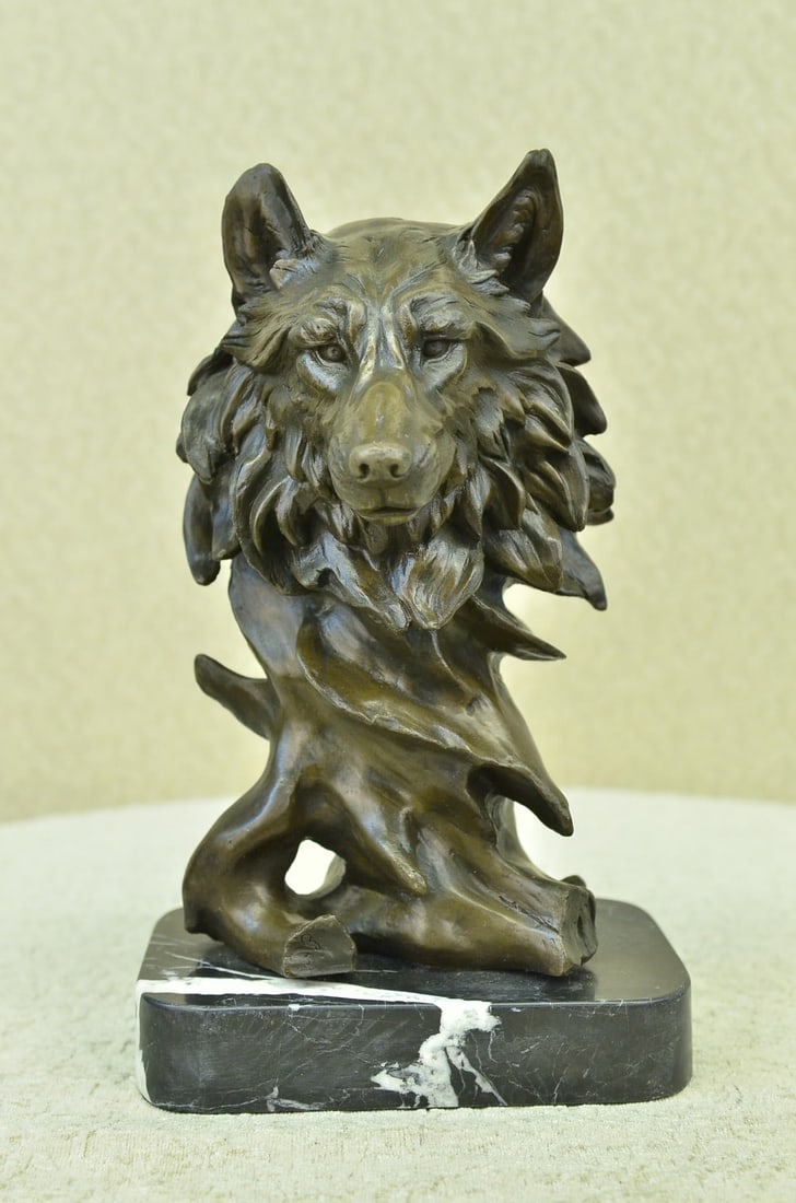 Wild Wolf Bronze Sculpture: This sculpture captures the wild dignity of the wolf. The base of the sculpture in its abstract sense resembles that of a winding tree trunk that blooms into a bust of a wolf head that stares out of i