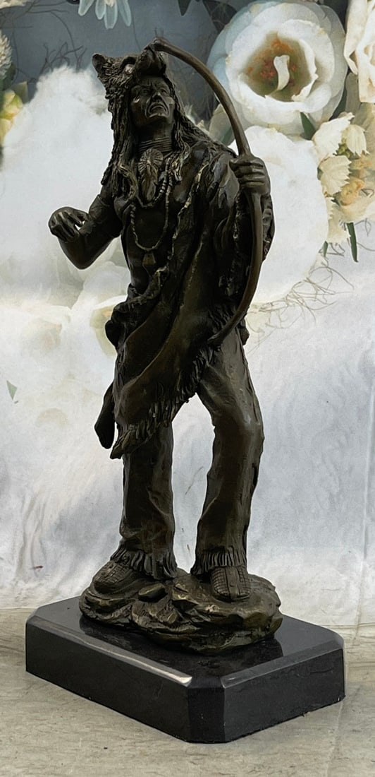 Indian Chief Warrior Bronze Sculpture: This impressionistic sculpture of the Indian chief instills a sense of pride, respect, and honor. He holds his bow tightly next to him ready to defend his people at moment. He has wolf headwear and