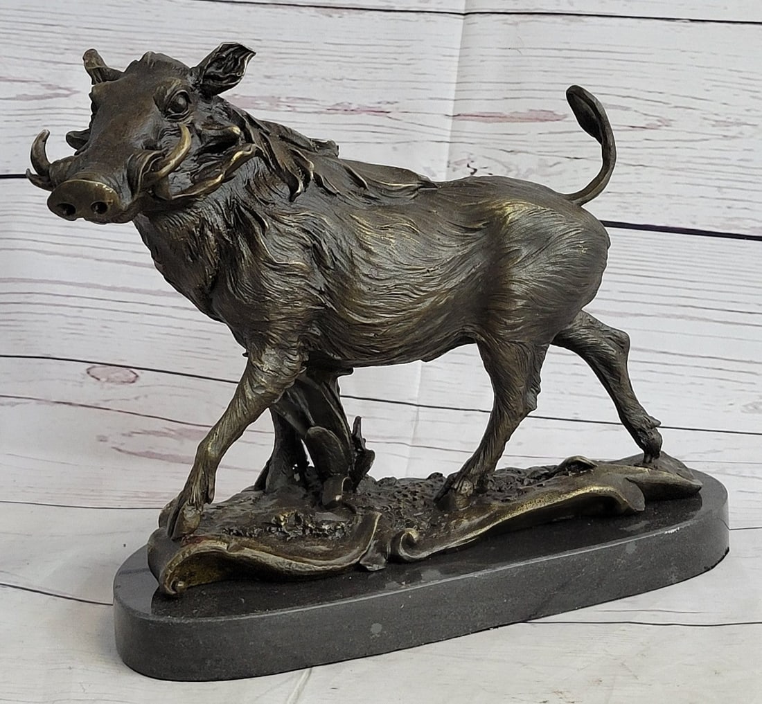 Wild Boar Animal Mascot Bronze Sculpture: The wild boar looks out at the beholder free and defiant coming out of the forest\'92s edge to forage for food in the late afternoon. From head to tail, his attitude demonstrates bold alertness to