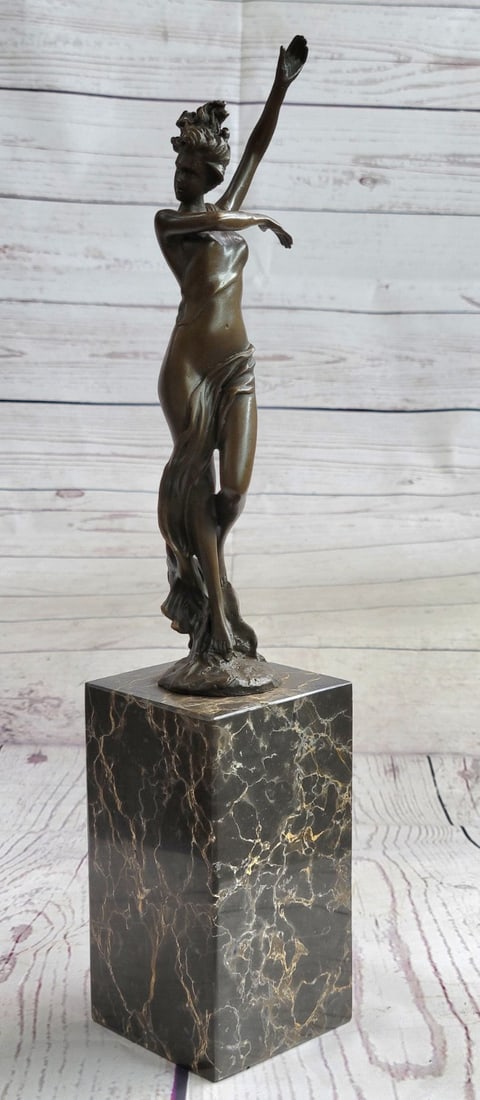 Nude Dancer Bronze Figure: Sexy, proud, and 100% confident, this beauty bears it all. She is no waif by any means, with round hips, curvy thighs, and full breast. She combs her fingers through her long hair and lets the