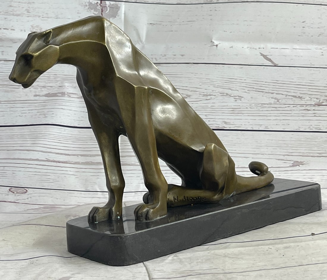 Cougar Bronze Sculpture: Though the most feared and lethal predator of the jungle, the beauty of a lion is undeniable. This bronze sculpture includes the smallest details of the king of all wild cats, including the stretch of