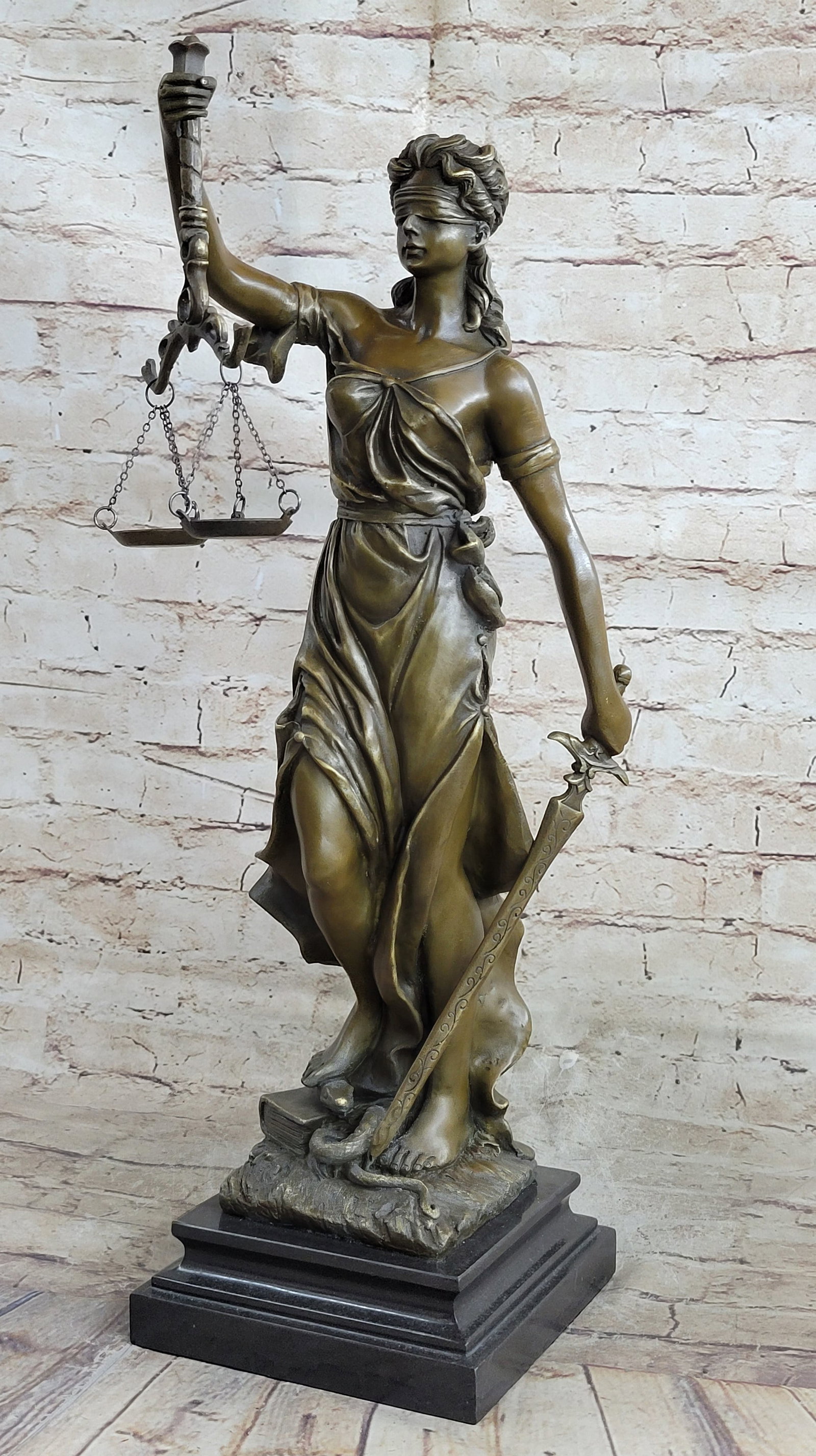 Lady Blind Justice Bronze Statue: Lady Justice and Blind Justice are the names associated, the goddess of Greek Mythology epitomizing the virtue of Justice. She holds the Sword of Truth in one hand to represent power and lifts her
