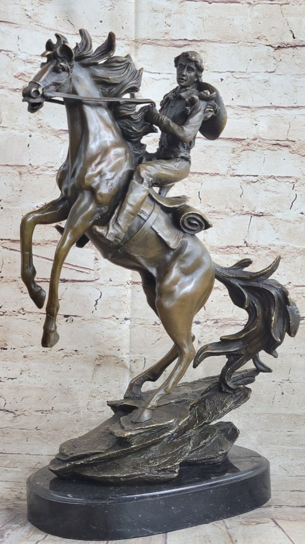 Western Cowboy Bronze Statue: It\'92s the Wild Wild West! This gunslinger, comfortable on his rearing horse, looks over the horse\'92s neck to watch ahead for his enemy. He\'92s ready to fire his weapon if need be as he travels hu