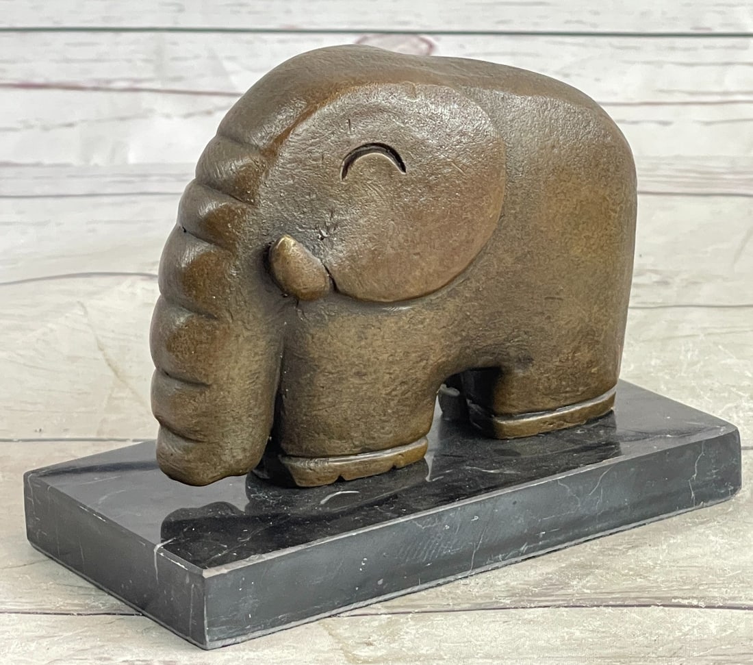Space Elephant Bronze Sculpture: This Sculpture was crafted using the lost wax method. Dimensions: Height 5 X Width 5 inches. Weight: 3 LBS.