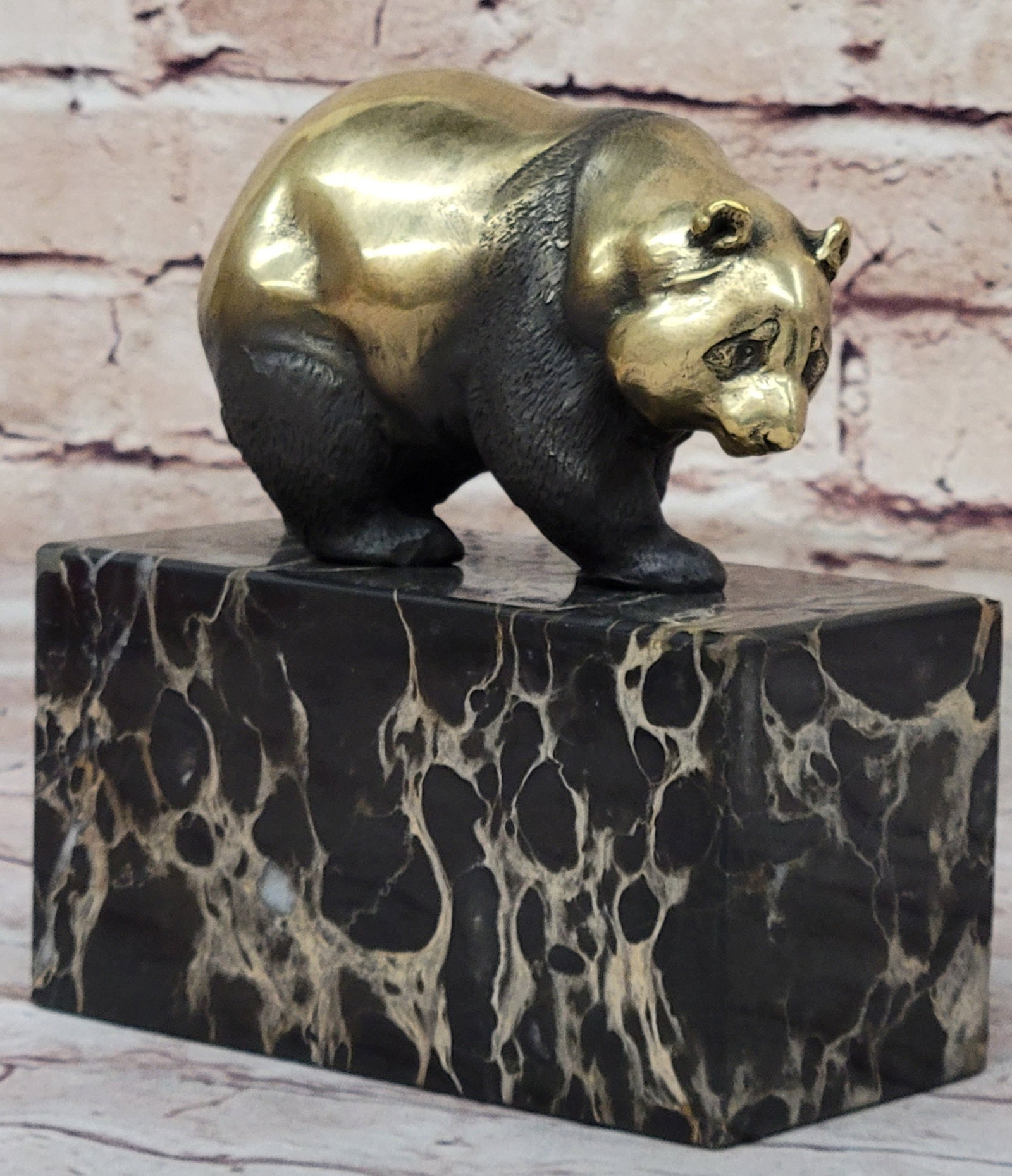 Panda Animal Edition Bronze Sculpture: The sculpture a cute lazy panda walking on the ground. The strikingly life-like animal features a slight patina that adds to the vibrancy of the artwork. This Sculpture was crafted using the lost wax 
