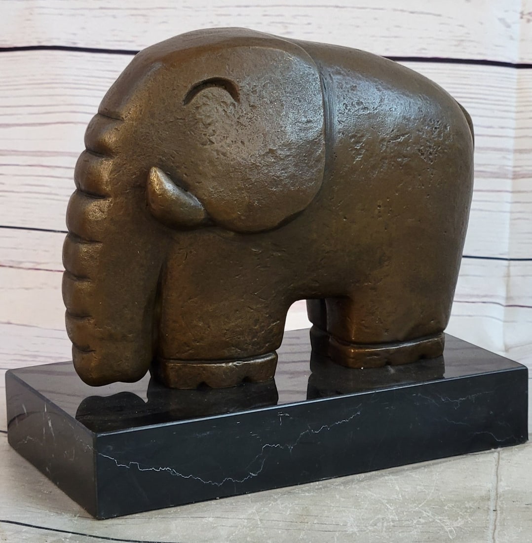 Modern Elephant Bronze Sculpture: Hot cast abstract modern art elephant bronze sculpture Figurine. It crafted using the lost wax method. Dimensions: Height 7 X Width 7 inches. Weight: 7 LBS.