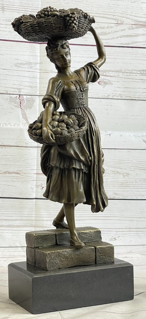 Peasant Girl With Fruit Basket Bronze Statue: Lady holding Fruit Basket Bronze Sculpture was cast by the traditional, Lost Wax Bronze Casting method. This labor-intensive and time-consuming method of casting bronze statues, ensure pristine qualit