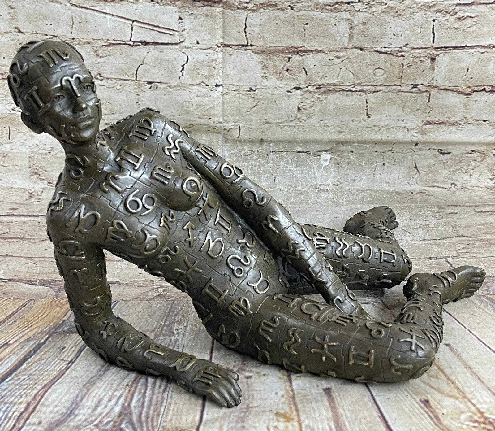 Female Symbols Money Wealth Lucky Charm Bronze Sculpture: This abstract is a very odd and creative one. The conversation on it will be mostly about how strange art is working its way through. She has a really fit body and her legs seem to be muscular, as tha