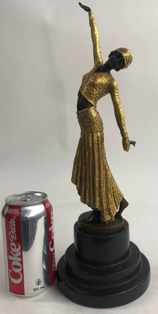 Egyptian Dancer Bronze Sculpture: With grace, agility, and flexibility, this Chiparus gypsy performs for an entranced crowd. She stands center stage. Her body moves fluidly and her arms stretch elegantly, one extending to the sky and 