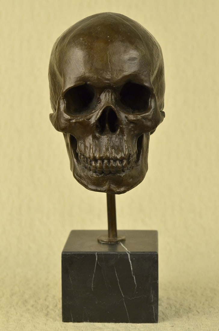 Skeleton Head Bust Halloween Bronze Sculpture: This is the creepiest yet most interesting at the same time sculpture. This skeleton is cast using the ancient old Lost Wax Method and is mounted atop a marble base. Dimensions: Height 14 X Width 7 in