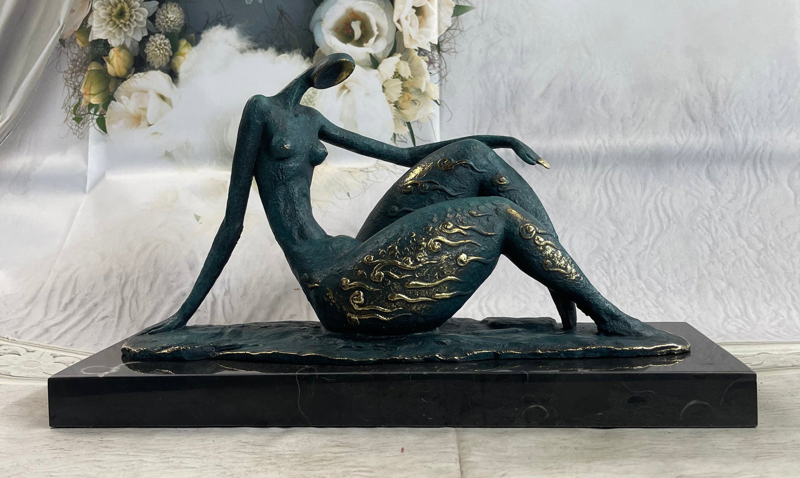 Modern Female Bronze Statue: An abstract female dancer sculpture. This wonderfully curvaceous woman bears the wide hips commonly attributed to femininity and fertility. This bronze sculpture was cast using the lost wax method