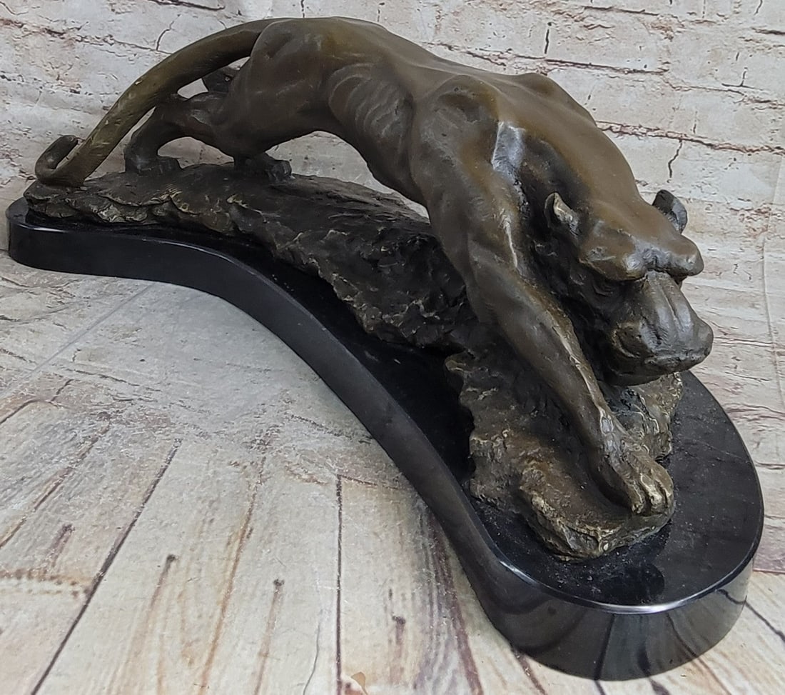 Mountain Lion Bronze Sculpture: The black Panther is one of the sexiest wild cats to strut the jungle. Black panthers are melanistic colors variants of several species of larger cats. Wild black panthers in Latin America are black