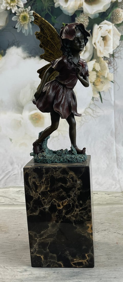 Angel Bronze Figure: Daydreamers will fall in love with this daydreaming fairy. Filled with youthful curiosity, she wanders around the mystical forest, her eyes taking in all the magic around her. She is lulled by the