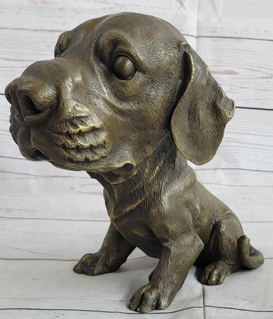 Adorable Labrador puppy Bronze Sculpture: This is an adorable statue of a Labrador puppy. He is sitting and looks up at you with big loving and adoring eyes, his eyes are shut. His paws are together in front of him and his tail curls around h