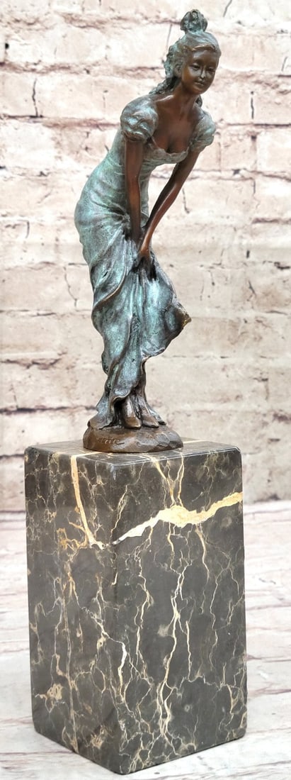 Brown Patina Lady Dancer Bronze Sculpture: This is a gorgeous Sculpture. She leans forward, placing her hands on her knees. Her hair is pulled up into a neat bun and she wears a loose dress. She tugs the hemline up to keep her dress from