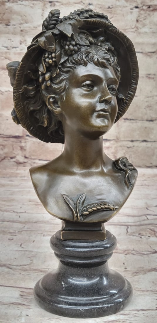 Nude Sexy Girl Bronze Figurine: It is a bust Statue of an elegant girl in a feathered dress hat. She is no doubt a woman of high standing going out for a royal day in town. She wears an intricately designed flower design over her