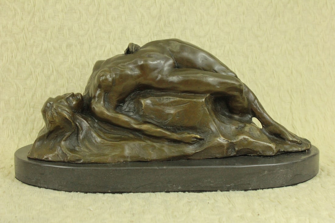 Nude Female on Rock Bronze Sculpture: Let your senses be heightened by this extremely sensual sculpture. Her nude bodice drapes over the rock conforming to it almost as if she becomes one with the rock. She shows her deep sensual soft sid