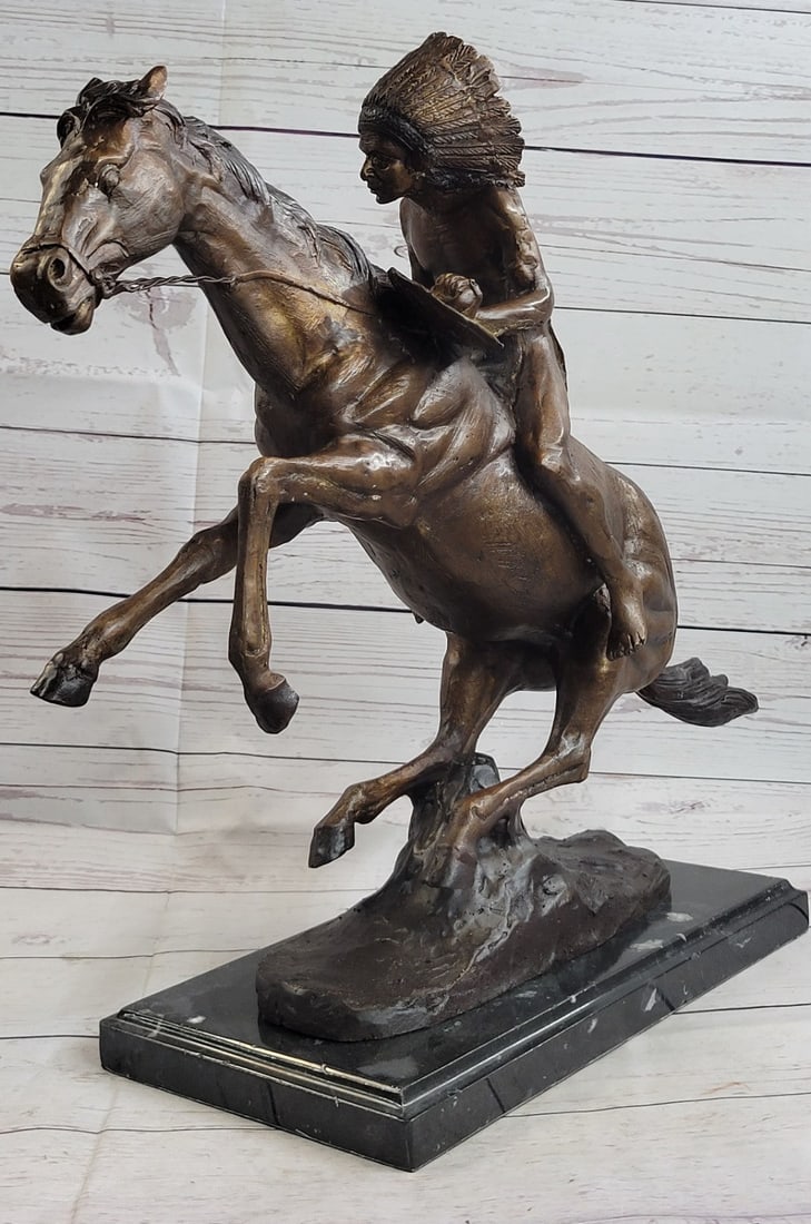 Native American Indian Horse Bronze Statue: A Native American Indian gallops across the desert with his horse. Armed with a spear, he leans into his horse body, ready to attack. The horse gallops ferociously, leaping over any obstacles. They le