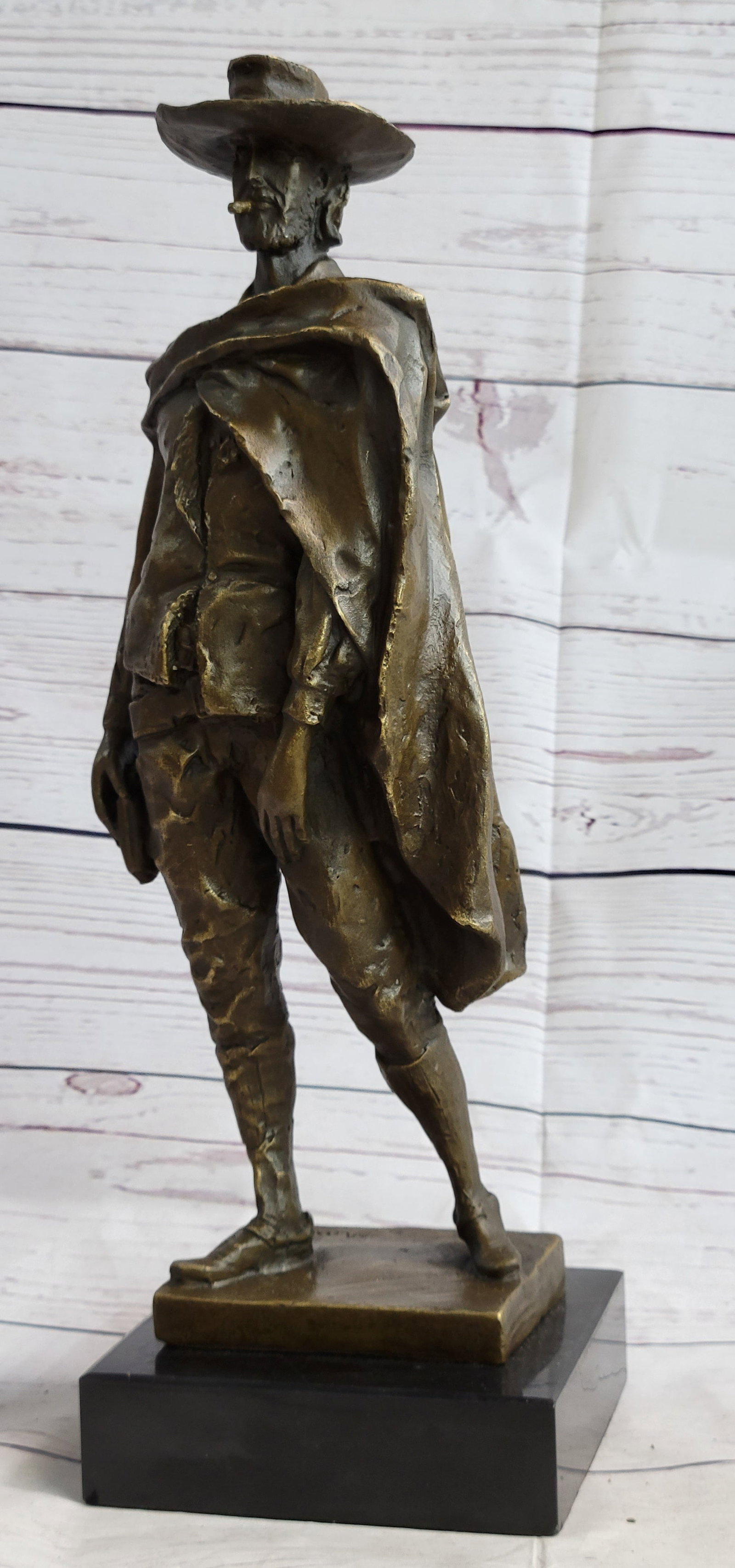 Collector Edition Western Outlaw Bronze Sculpture: The sculpture is hand-made using the Lost Wax Method and a two-toned brown patina is used and he rests on a marble base. Dimensions: Height 11 X Width 13 inches. Weight: 14 LBS.